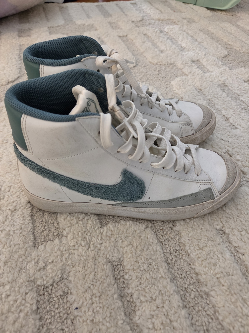 Nike Kids' White High-Top Sneakers with Teal Fuzzy Logo. Size 7 youth
